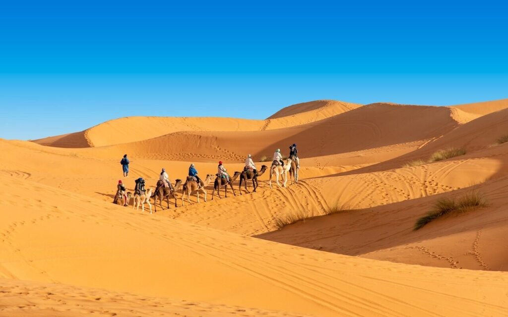 Sahara camel ride experience in Morocco with desert camp”